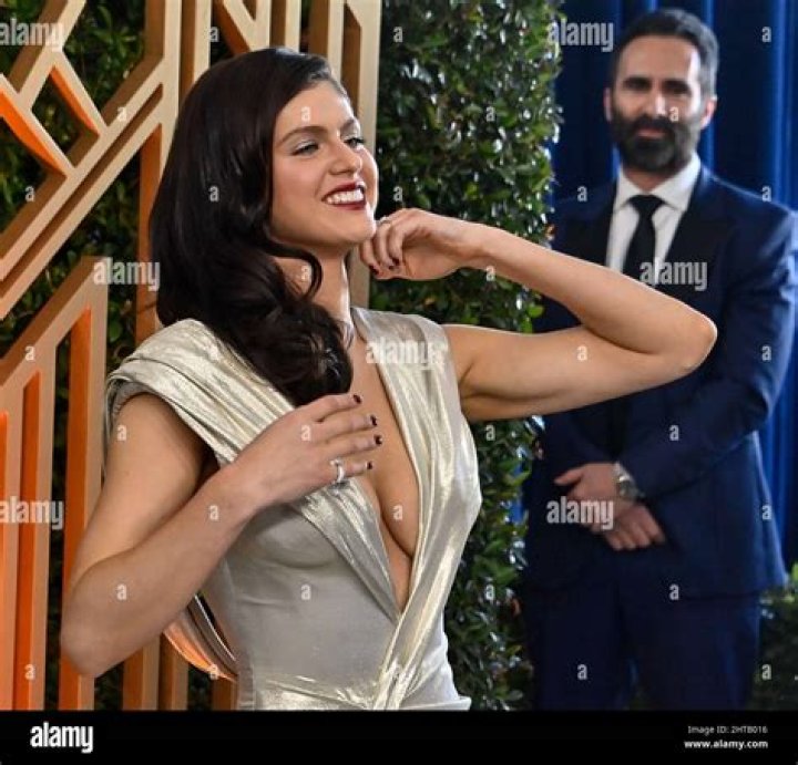 Deep Plunging Silver Gown – Hollywood Life