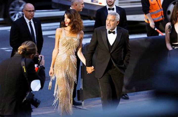 George & Amal Clooney Cuddle On Red Carpet At Clooney Foundation Gala – Hollywood Life