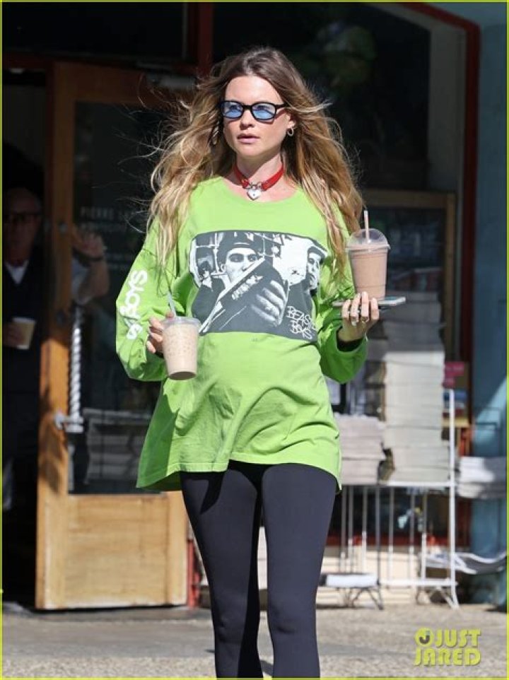 Behati Prinsloo Cradles Baby Bump In Cropped Cardigan For Halloween After Adam Levine Drama