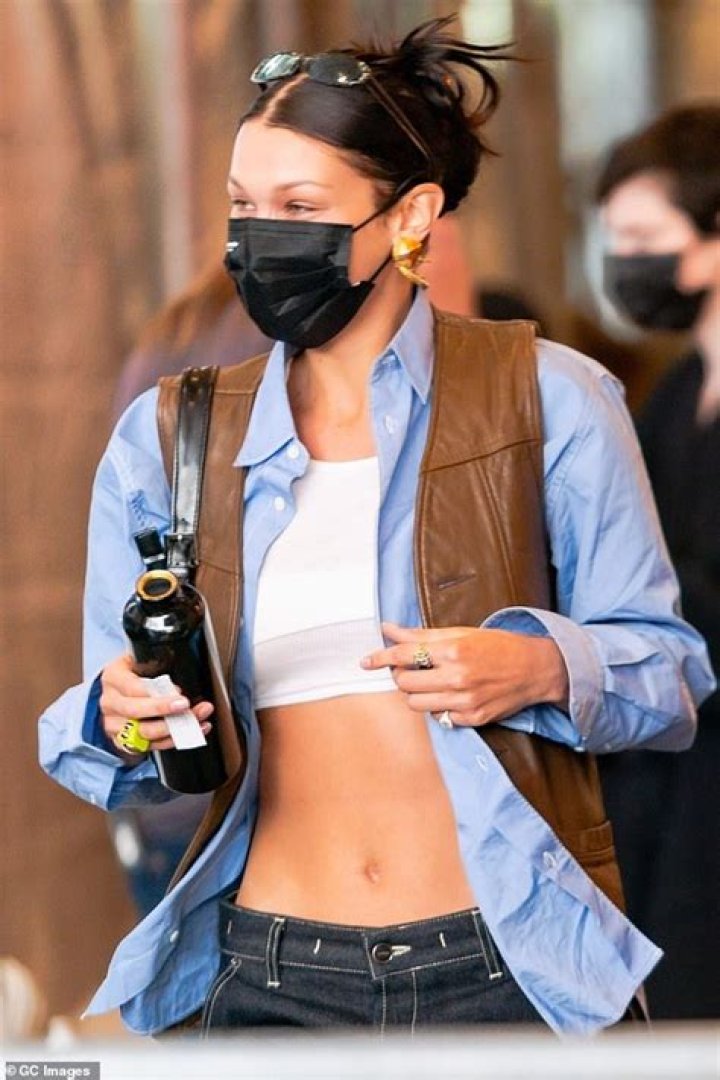 Bella Hadid Rocks A Very Unbuttoned Blouse While Quarantined With Pregnant Sister Gigi & Zayn