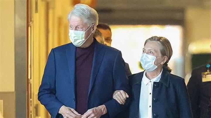 Bill Clinton Links Arms With Wife Hillary As He’s Discharged From Hospital After Infection – Photos
