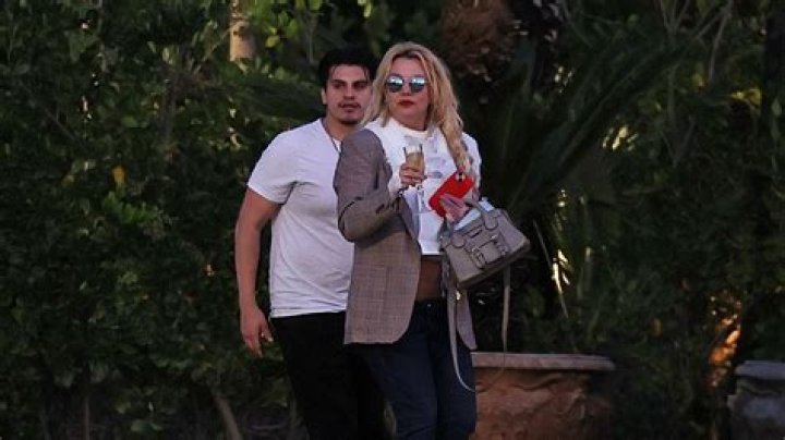 Britney Spears Shares Flirty Pool Day Video in Tiny String Bikini With Manager Benjamin Mallin