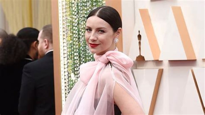 Caitriona Balfe Dazzles In A Black Dress With Sheer Pink Blouse At 2020 Oscars