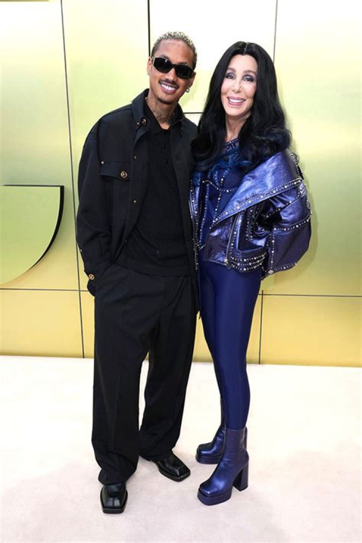Cher, 76, & Alexander Edwards, 37, Kiss At Versace Show: Photos