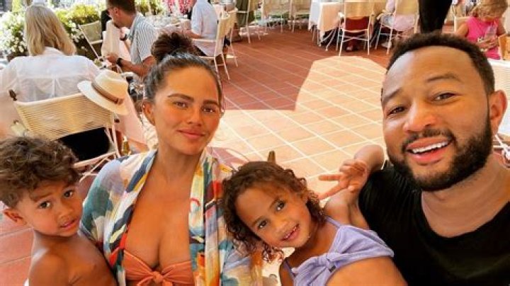 Chrissy Teigen Looks Amazing In Neon Pink Swimsuit On Vacation With John Legend & Kids