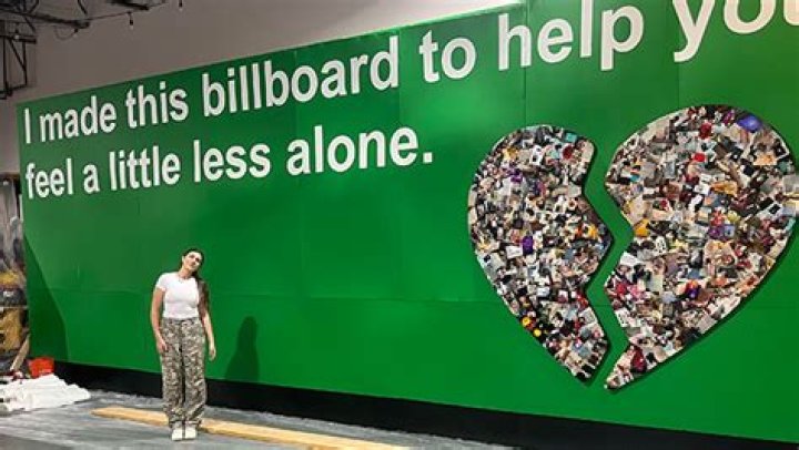 Emilee Moore Performs Outside of Coachella With Billboard Promising Fans They’re Not ‘Alone’ in Heartbreak