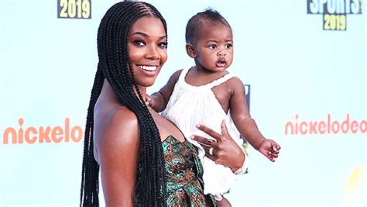 Gabrielle Union, 48, Rocks Sexy Plunging Swimsuit & Twins With Daughter Kaavia, 2, On The Beach