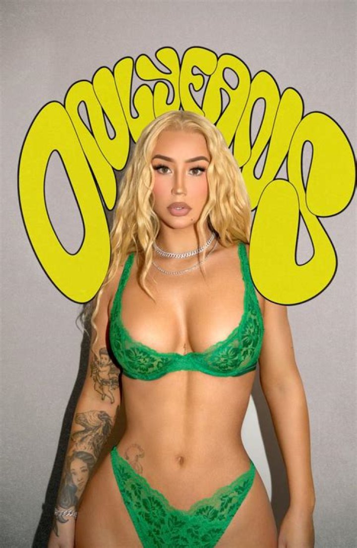 Iggy Azalea Rolls Her Tongue & Kicks Off 2021 In A Sheer Bra During Sexy Photo Shoot — Watch