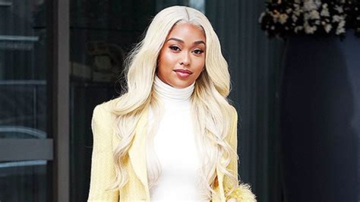 Jordyn Woods Wears Blonde Wig, Skinny Jeans, & Yellow Coat In London – Hollywood Life