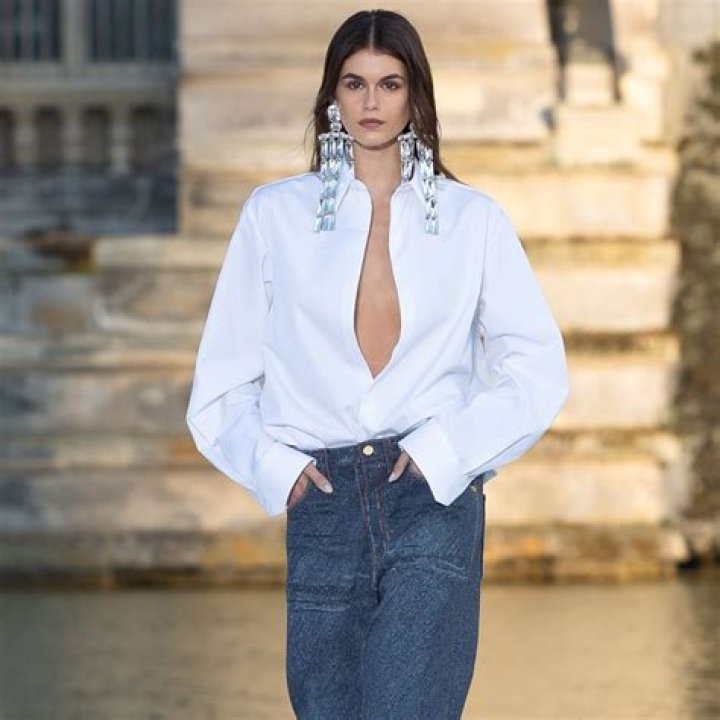 Kaia Gerber Confidently Walks Valentino Runway In Sheer Black Bow Blouse