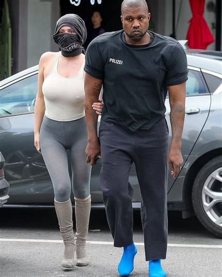 Kanye West Posts Racy Photo of Wife Bianca Censori Wearing a Swimsuit & Face Mask in the Kitchen