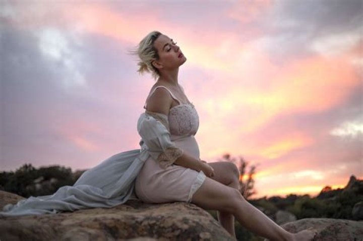 Katy Perry Bares All & Reveals Her Growing Baby Bump In Dream-Like Music Video For ‘Daisies’