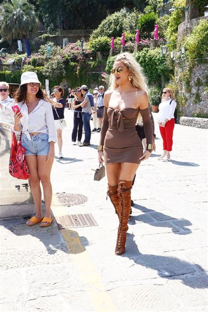 Khloe Kardashian Sizzles In Strapless Mini Dress & Lace Up Boots For Lunch Before Kourtney’s Wedding: Photo
