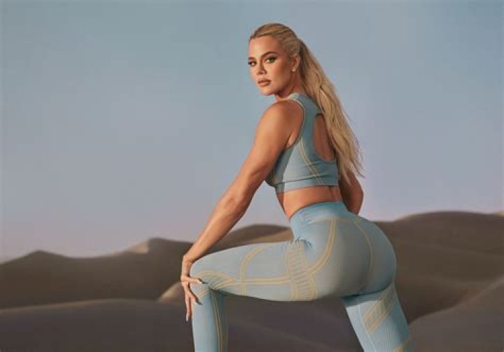Khloe Kardashian Rocks A Sexy Sports Bra & Tight Leggings During Home Workout