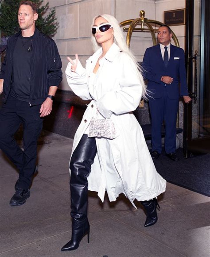 Kim Kardashian Rocks Thigh-High Leather Boots With Bodysuit & Trench Coat For Night Out In NYC