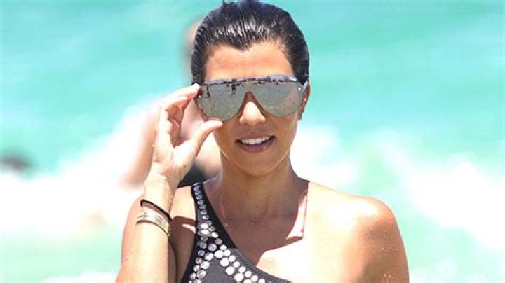 Kourtney Kardashian, 43, Has A Blast In Sleek Zippered Swimsuit & Gloves Out On Lake: Photos
