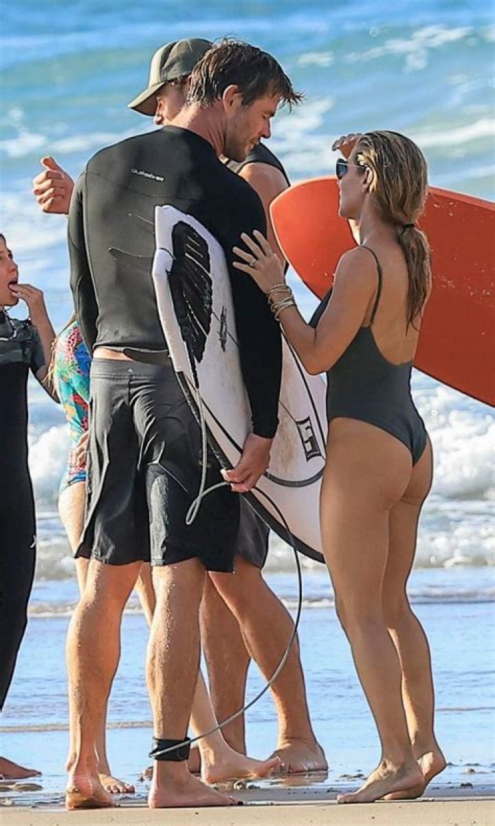 Liam Hemsworth Goes Surfing & Strips Out Of Wetsuit After Sister-In-Law Disses His Ex, Miley Cyrus 