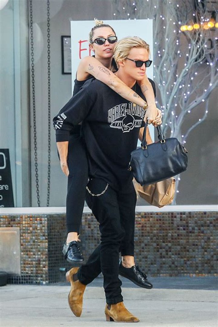Miley Cyrus & Cody Simpson Twin In All Black As He Gives Her A Piggyback Ride On Lunch Date