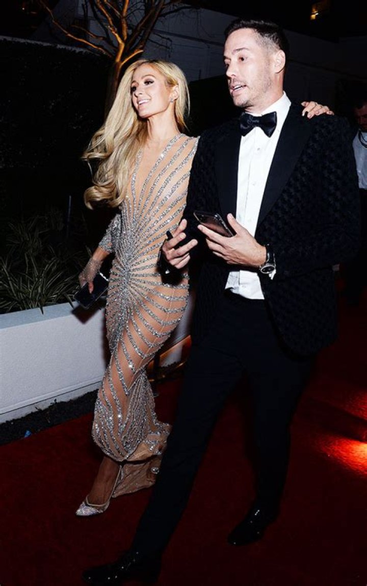 Paris Hilton Trolled For Wearing A Diamond, Mesh Face Covering On Date Night With BF Carter Reum — See Pic