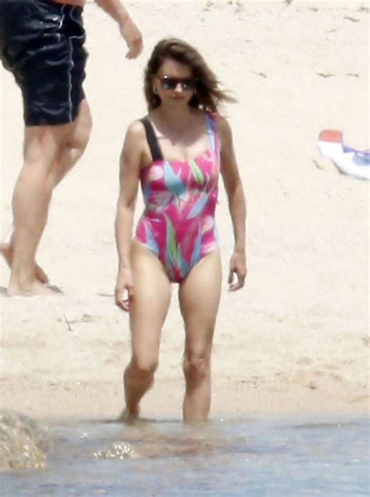 Penelope Cruz, 47, Stuns In Pink Swimsuit As She Goes For A Dip With Husband Javier Bardem