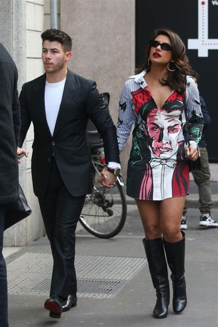 Priyanka Chopra Slays In Colorful Mini Dress & Boots While Holding Hands With Nick Jonas — Pics