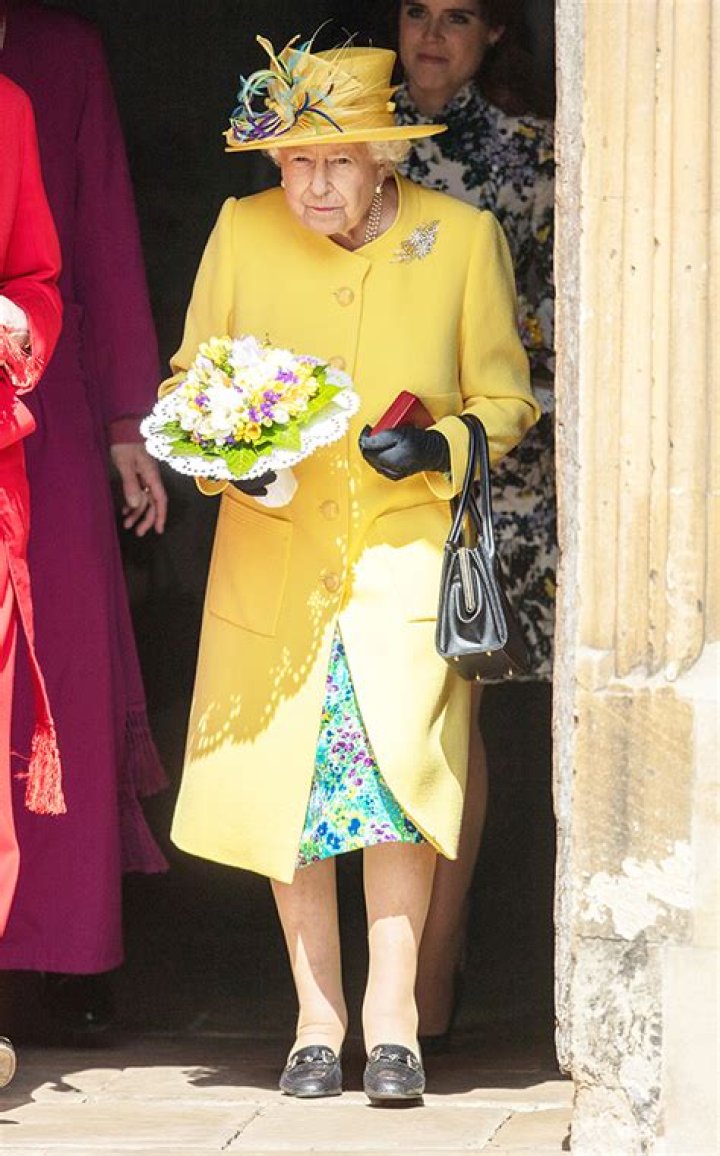 Queen Elizabeth Looks Ready For Easter In Yellow Hat With Feathers & Matching Coat — Pics