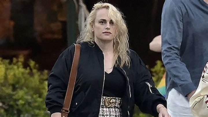 Rebel Wilson Stuns In A Low Cut Black Top & Plaid Skirt As She Vacations In Italy – Photo