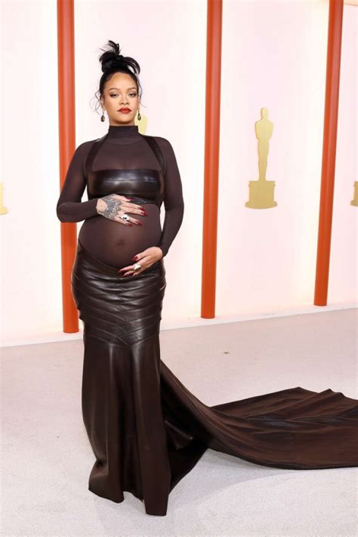 Rihanna Shows Off Her Baby Bump In Sexy Sheer Gown At Jay-Z’s Oscar Party