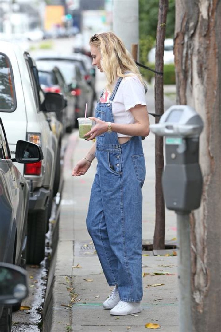 Sophie Turner Steps Out In Loose-Fitting Overalls With Husband Joe Amid Pregnancy Reports