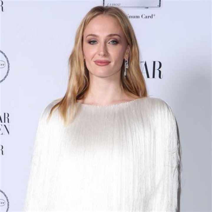Sophie Turner Looks Angelic As She Shows Off Her Baby Bump In All White Mini Dress  