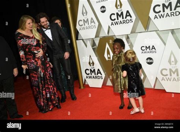 Thomas Rhett’s Kids Willa Gray, 4, & Ada James, 2, Make Adorable Red Carpet Debut At CMA Awards