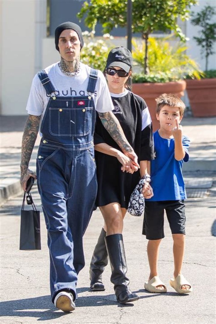 Travis Barker Has A Blast With Kourtney’s Son Reign Disick, 6, On A Water Slide Over MDW — Watch