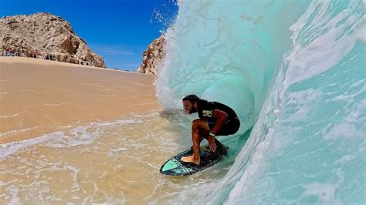 Tyler Cameron Shows Off His Ripped Abs While Skimboarding After Hanging Out With Hot Model